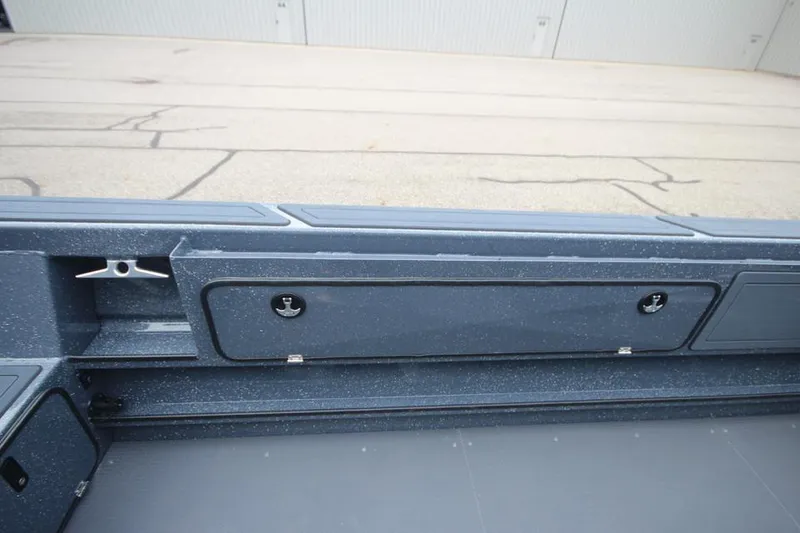 Slide: The Image of 2025 Weldcraft 200 Rebel Open boat interior, featuring storage compartments and sleek design. - 24