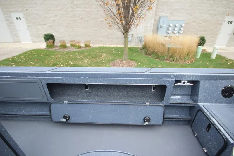 Slide: The Image of 2025 Weldcraft 200 Rebel Open boat interior with storage compartments. - 25