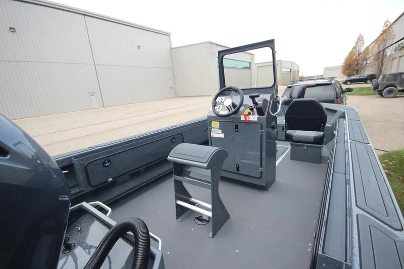 Slide: The Image of 2025 Weldcraft 200 Rebel Open boat with F150hp engine, docked outdoors. - 8