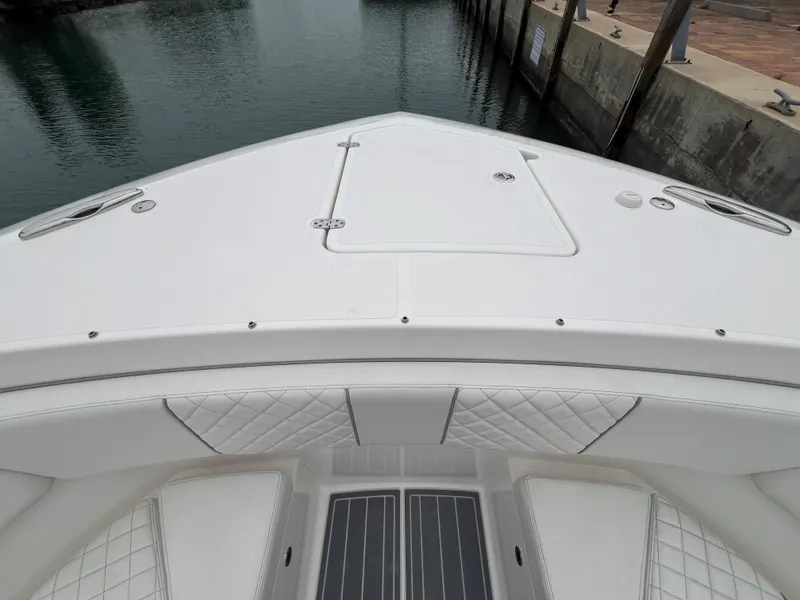 Slide: The Image of 2023 Pursuit 428 Sport boat bow with sleek design and quilted seating. - 18