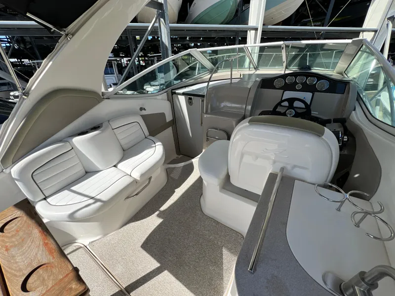 Slide: The Image of Interior of 2006 Sea Ray 290 Sundancer boat with seating and helm. - 19