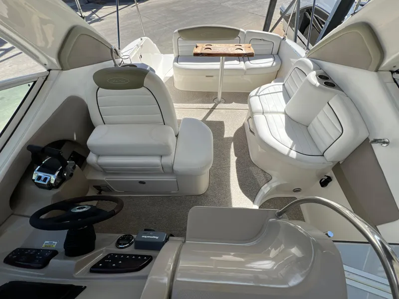 Slide: The Image of Interior of 2006 Sea Ray 290 Sundancer boat with seating and helm. - 23