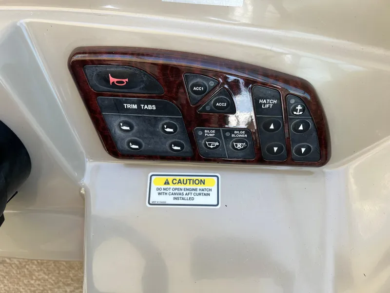 Slide: The Image of Control panel of 2006 Sea Ray 290 Sundancer boat with caution label. - 30