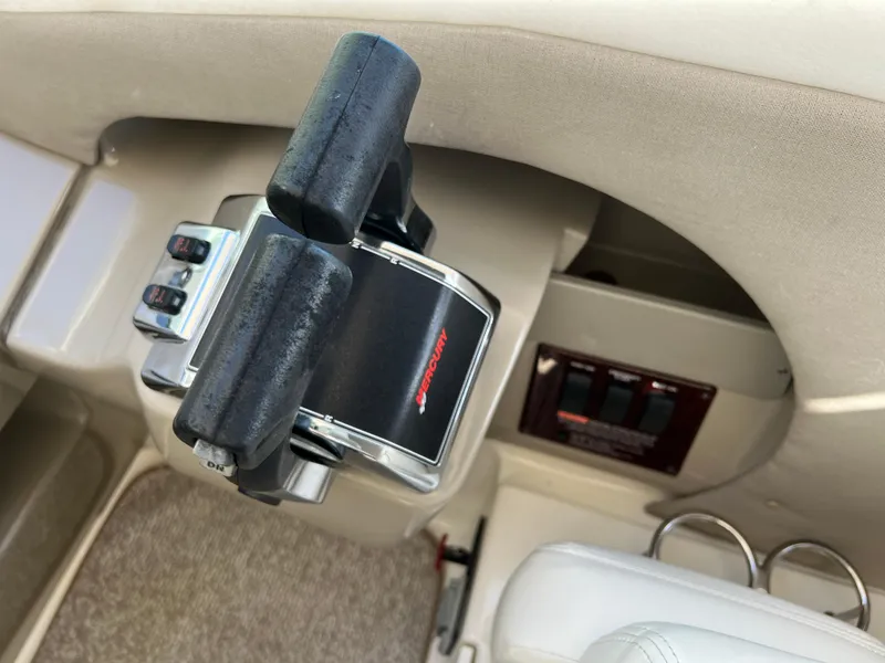 Slide: The Image of Close-up of 2006 Sea Ray 290 Sundancer throttle controls in cockpit. - 31
