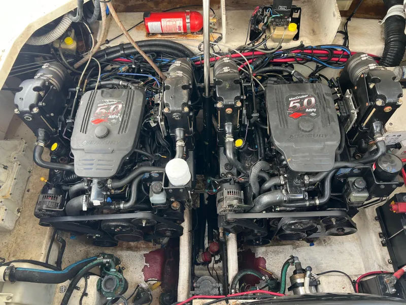 Slide: The Image of Twin engines of a 2006 Sea Ray 290 Sundancer boat. - 32