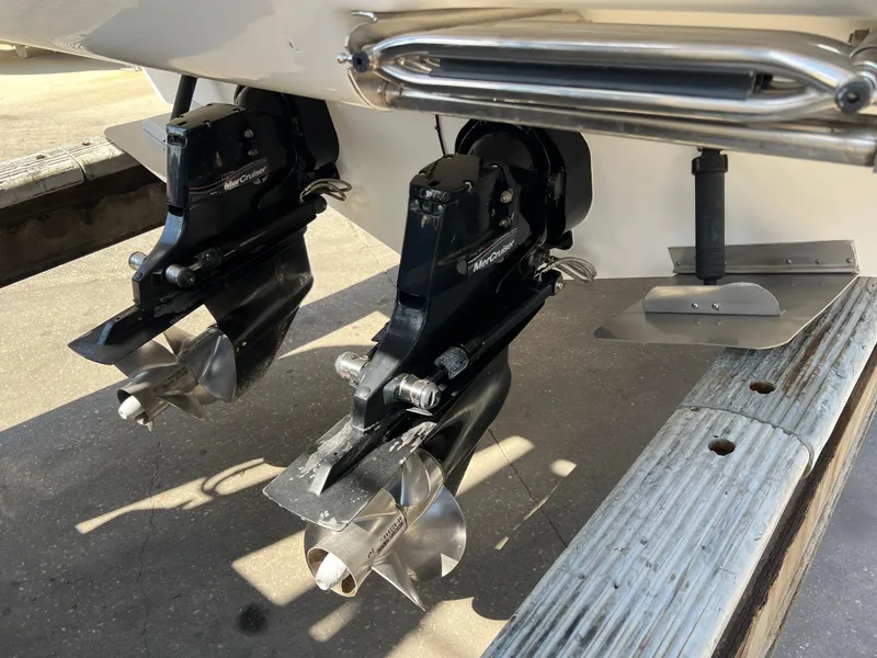 Slide: The Image of 2006 Sea Ray 290 Sundancer boat propellers and stern drive close-up. - 36