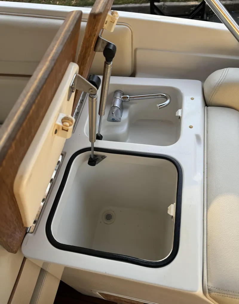 Slide: The Image of 2008 Chris-Craft Launch 28 boat sink and storage compartment detail. - 13