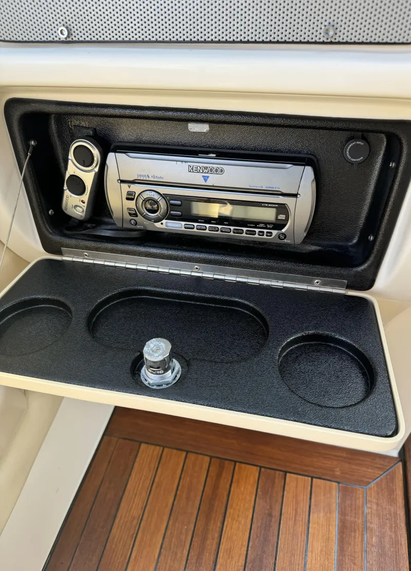 Slide: The Image of 2008 Chris-Craft Launch 28 stereo system with wooden deck and cup holders. - 14