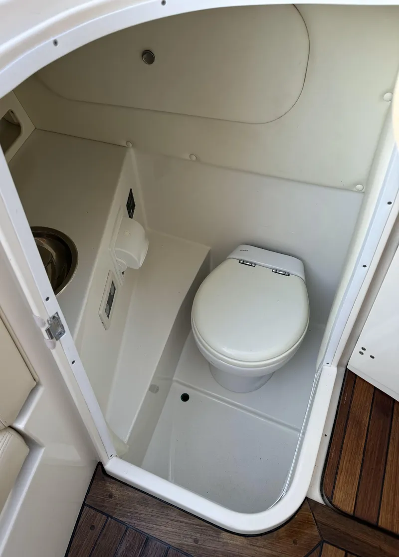Slide: The Image of 2008 Chris-Craft Launch 28 boat interior with compact marine toilet and sink. - 15