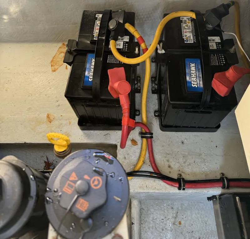 Slide: The Image of Batteries in a 2008 Chris-Craft Launch 28 boat with connected cables. - 18