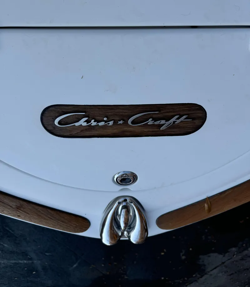 Slide: The Image of 2008 Chris-Craft Launch 28 boat stern with logo and chrome details. - 6