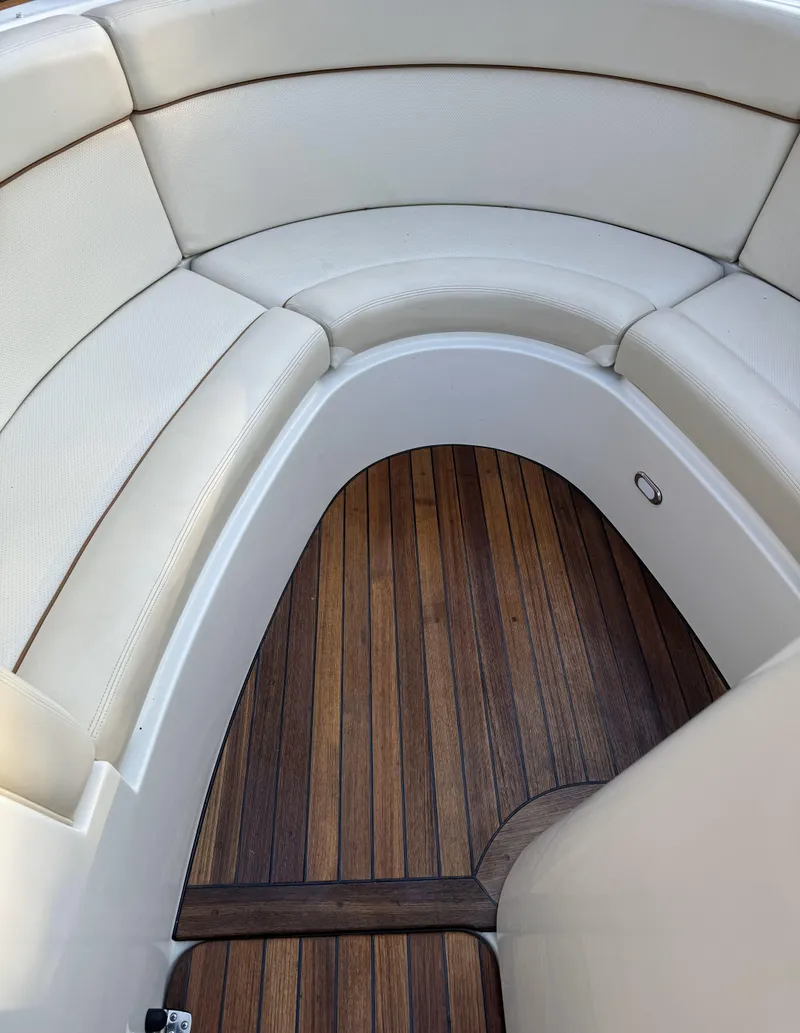 Slide: The Image of 2008 Chris-Craft Launch 28 interior with elegant wood flooring and cream seating. - 9