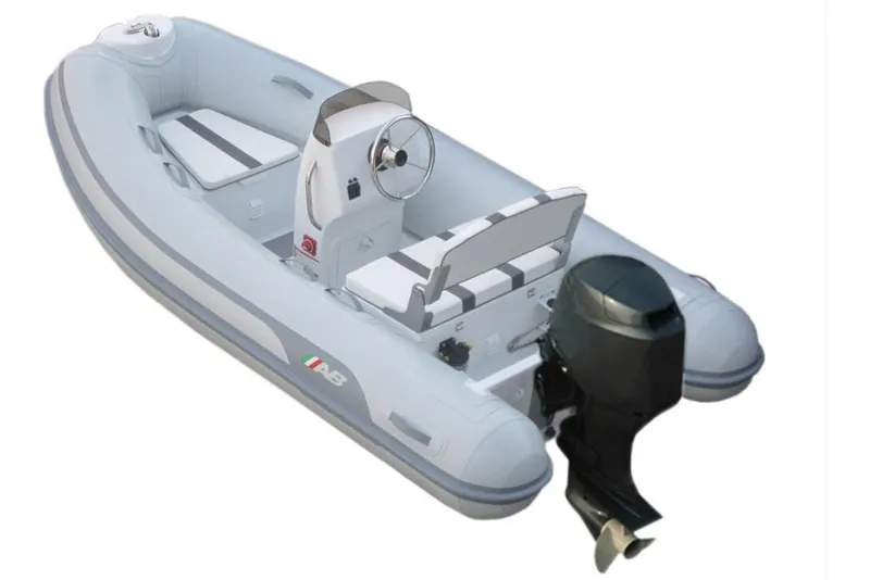 Slide: The Image of 2024 AB Inflatables Alumina 10 ALX boat interior with steering console and seating. - 3
