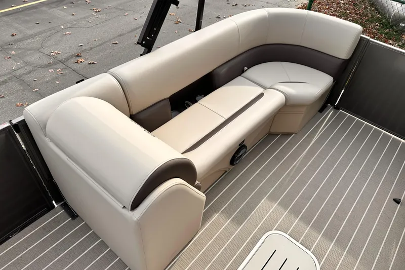 Slide: The Image of 2025 Bentley Pontoons Legacy 243 Swingback interior seating, beige and brown upholstery. - 13