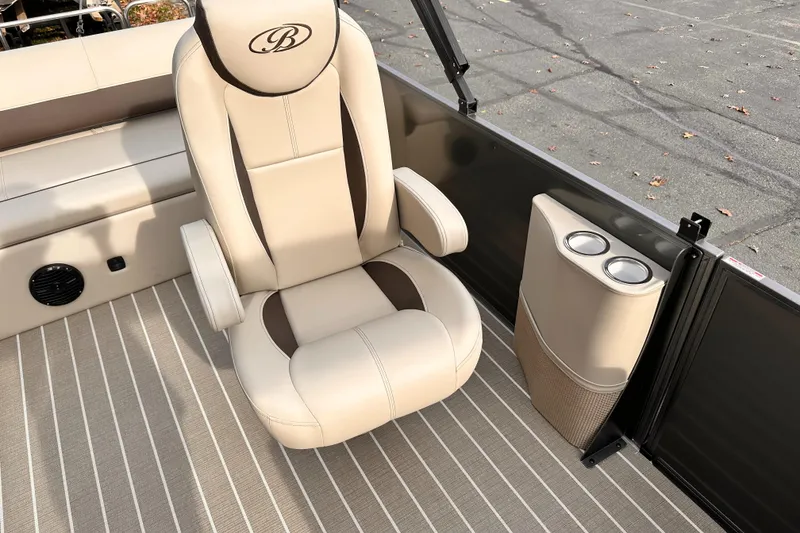 Slide: The Image of 2025 Bentley Pontoons Legacy 243 Swingback interior with luxury seating and cup holders. - 17