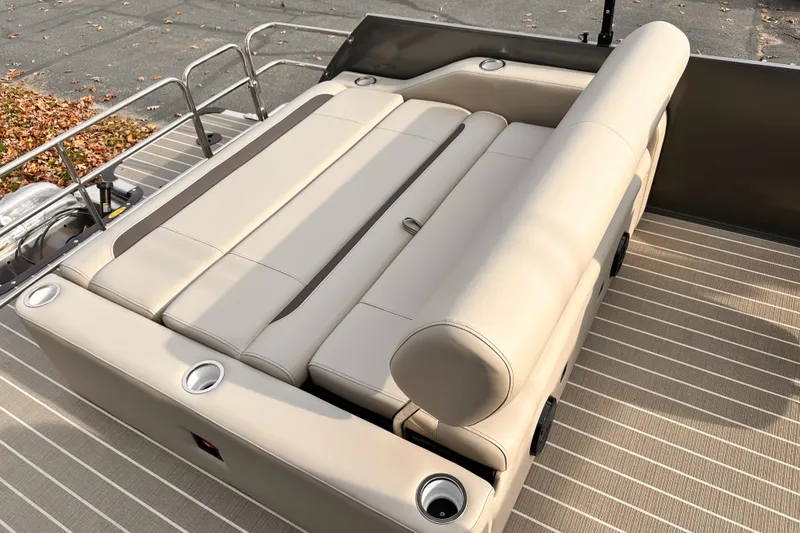 Slide: The Image of 2025 Bentley Pontoons Legacy 243 Swingback with luxurious seating and cup holders. - 27