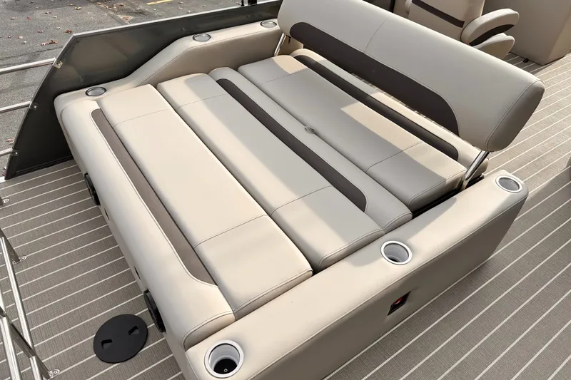 Slide: The Image of 2025 Bentley Pontoons Legacy 243 Swingback with luxurious seating and cup holders. - 28