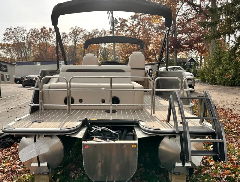 Slide: The Image of 2025 Bentley Pontoons Legacy 243 Swingback, rear view, parked outdoors in autumn setting. - 3