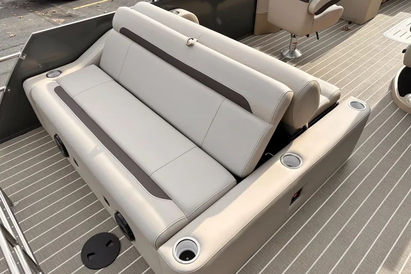 Slide: The Image of 2025 Bentley Pontoons Legacy 243 Swingback interior seating with cup holders on striped flooring. - 30