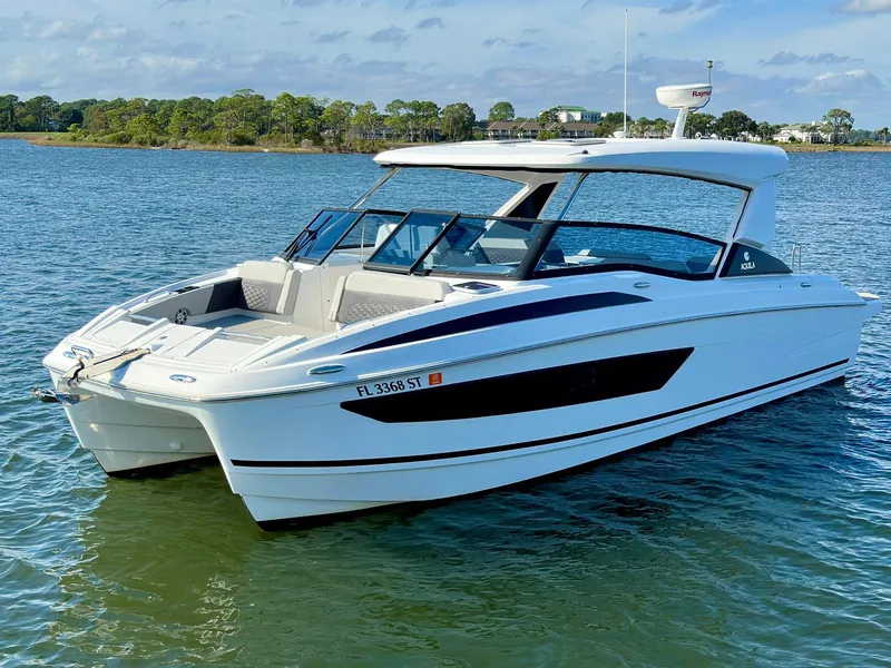 Slide: The Image of 2020 Aquila 32 Sport catamaran on calm water, featuring sleek design and modern amenities. - 0