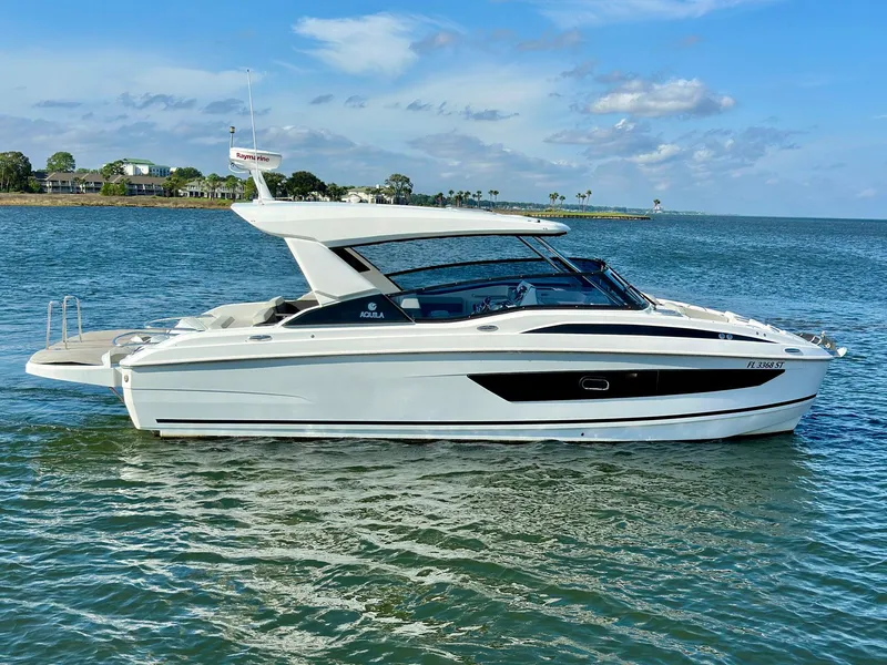 Slide: The Image of 2020 Aquila 32 Sport yacht cruising on a sunny day. - 7
