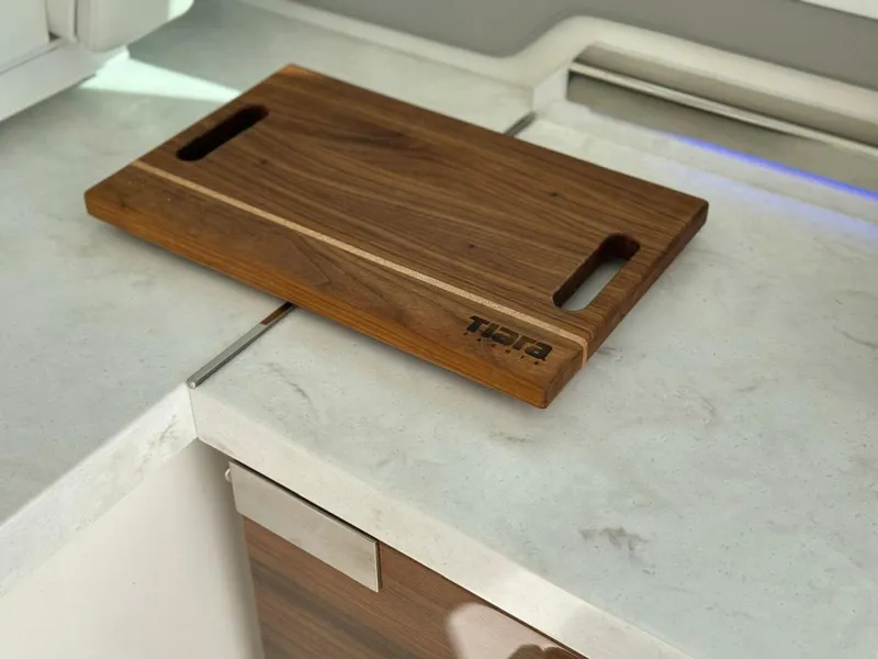 Slide: The Image of Wooden cutting board on Tiara Yachts 43 LE 2022 kitchen counter. - 10