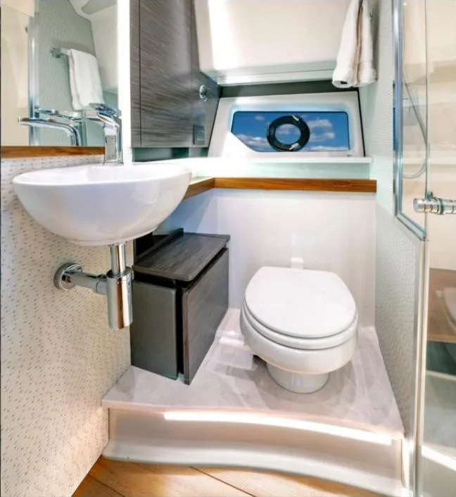 Slide: The Image of Luxurious bathroom in 2022 Tiara Yachts 43 LE, featuring modern sink and toilet. - 12