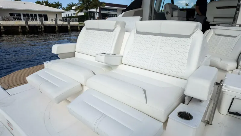 Slide: The Image of Luxurious seating on 2022 Tiara Yachts 43 LE, featuring elegant white upholstery. - 6