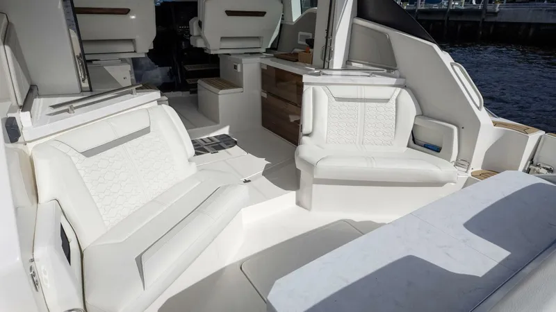 Slide: The Image of Luxurious interior of 2022 Tiara Yachts 43 LE with elegant white seating. - 8