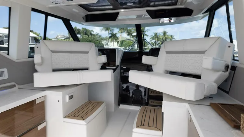 Slide: The Image of Interior of 2022 Tiara Yachts 43 LE with luxurious seating and modern design. - 9