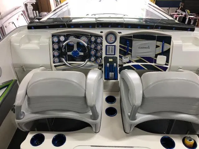 Slide: The Image of 2006 MTI 44 Pleasure Cat cockpit with dual seats and advanced navigation controls. - 10