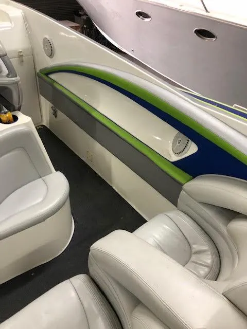 Slide: The Image of 2006 MTI 44 Pleasure Cat interior with white and green seating. - 11