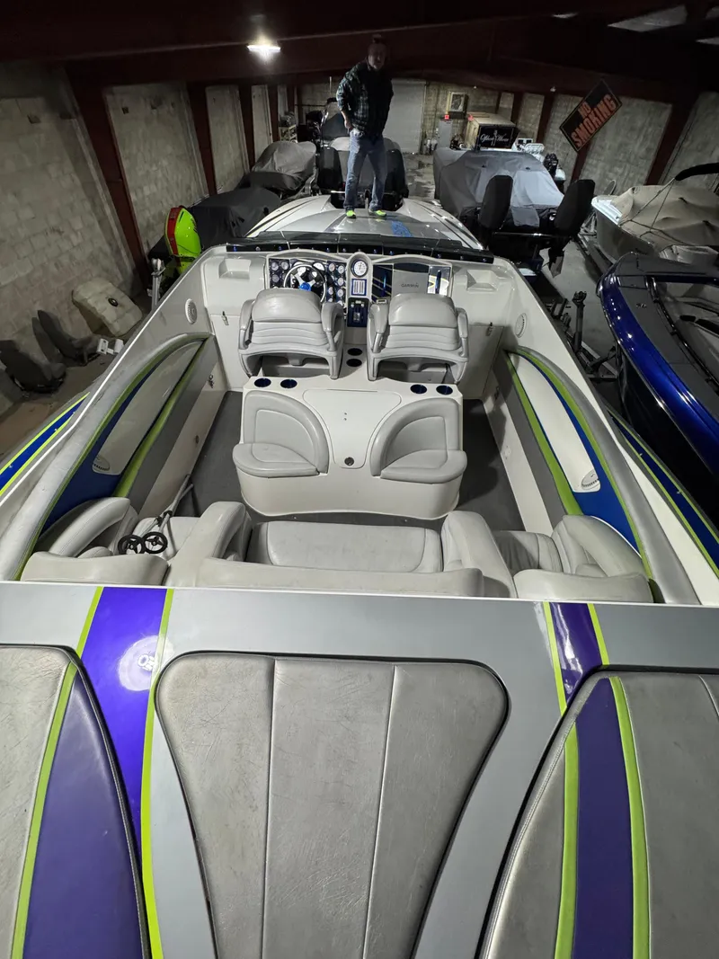 Slide: The Image of 2006 MTI 44 Pleasure Cat boat interior with seating and dashboard in storage. - 12