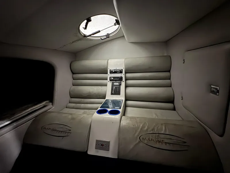 Slide: The Image of Interior of 2006 MTI 44 Pleasure Cat with plush seating and control panel. - 13