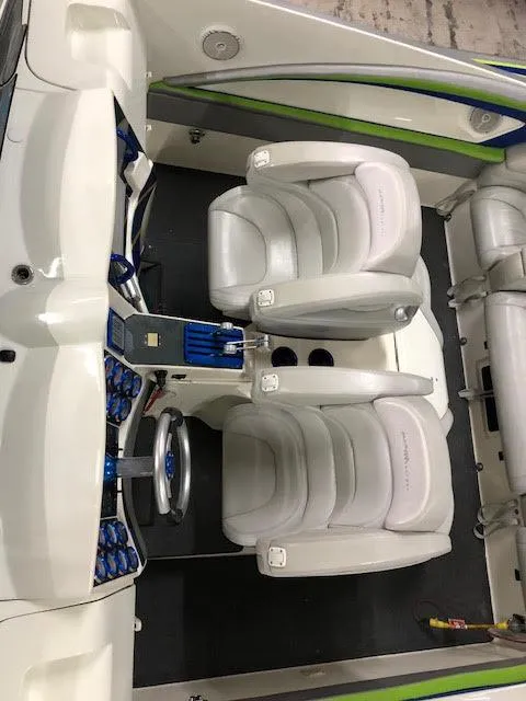 Slide: The Image of Interior of 2006 MTI 44 Pleasure Cat boat with white seating and blue accents. - 8
