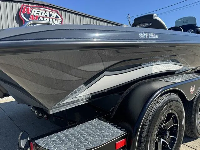 Slide: The Image of 2025 Phoenix 921 ELITE boat with sleek design at Wieda's Marine dealership. - 10