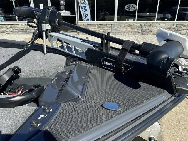 Slide: The Image of Phoenix 921 ELITE 2025 boat with Minn Kota trolling motor on deck. - 19