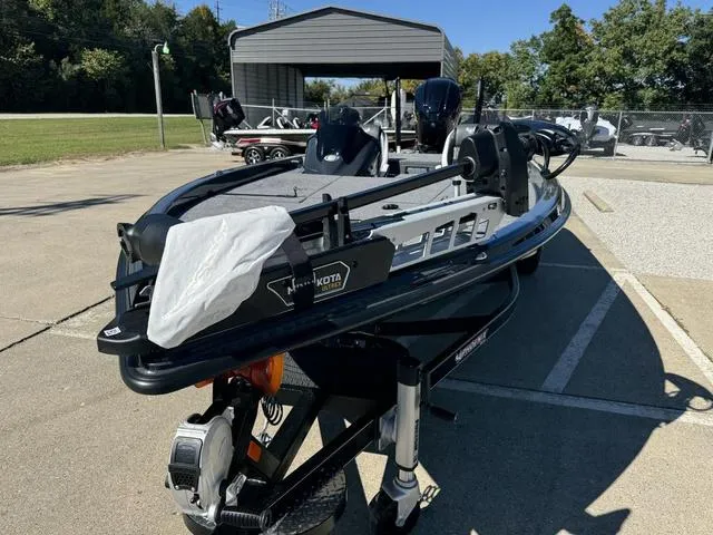 Slide: The Image of 2025 Phoenix 921 ELITE fishing boat on trailer in parking lot. - 21