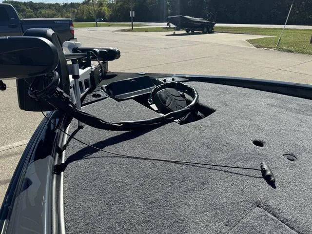 Slide: The Image of 2025 Phoenix 921 ELITE boat deck with mounted equipment in a sunny outdoor setting. - 23