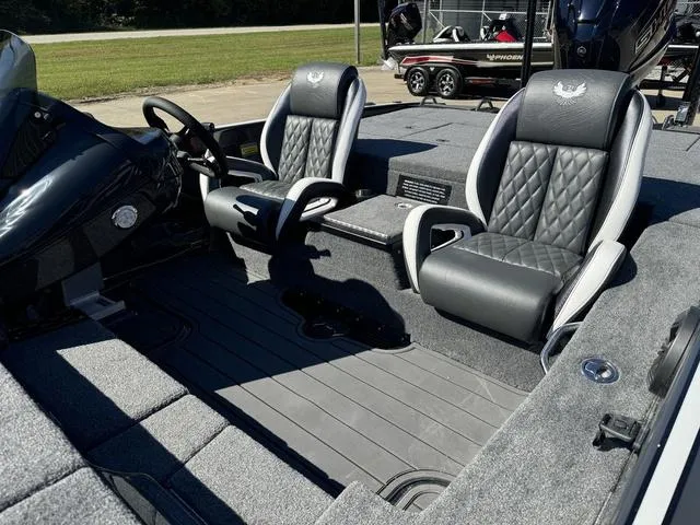 Slide: The Image of 2025 Phoenix 921 ELITE boat interior with luxury seating and modern design. - 24