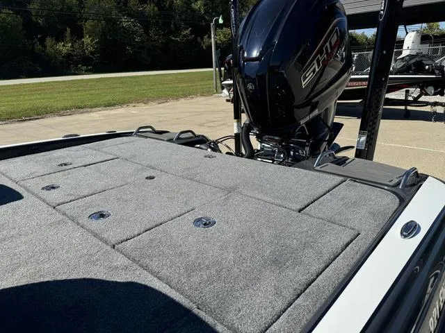 Slide: The Image of 2025 Phoenix 921 ELITE boat with sleek design and powerful engine on display. - 27