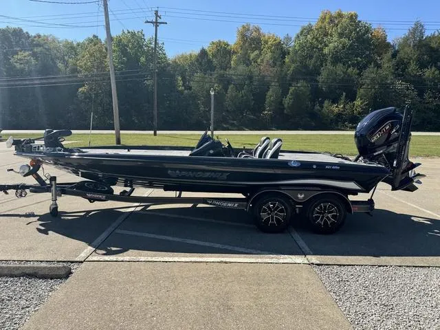 Slide: The Image of 2025 Phoenix 921 ELITE bass boat on trailer, parked outdoors. - 29