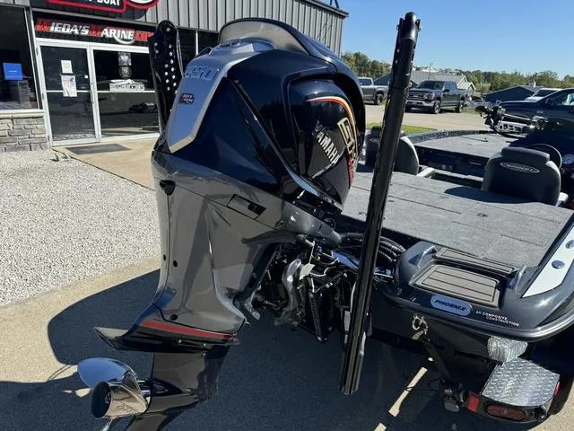 Slide: The Image of 2025 Phoenix 921 ELITE boat with Yamaha engine at a dealership. - 3