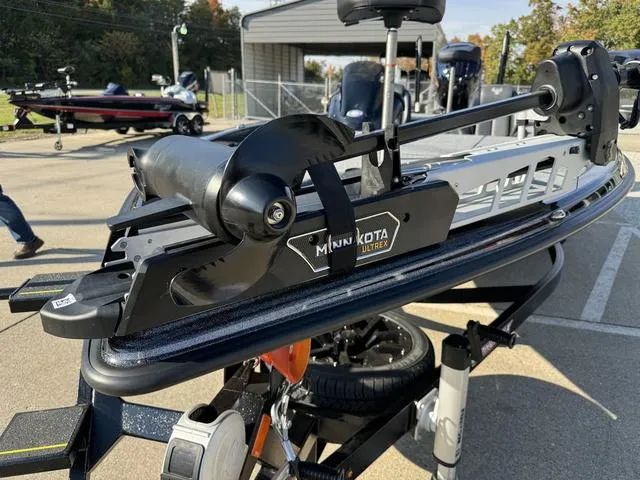 Slide: The Image of Minn Kota Ultrex trolling motor on 2025 Phoenix 921 ELITE boat, outdoor setting. - 13