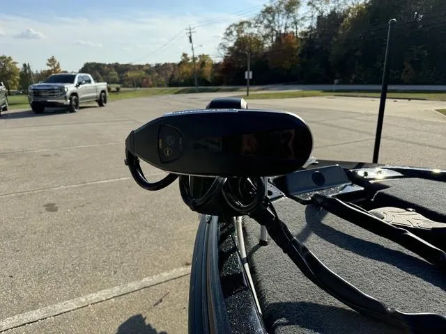 Slide: The Image of Close-up of a 2025 Phoenix 921 ELITE boat component in a parking lot. - 14