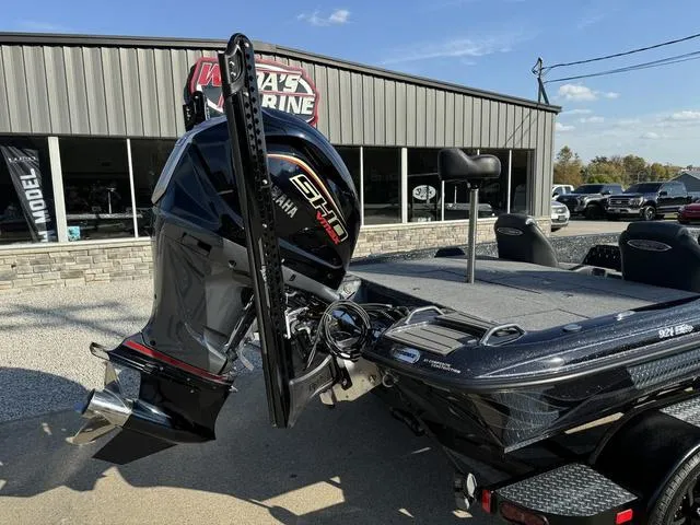 Slide: The Image of 2025 Phoenix 921 ELITE boat with Yamaha engine at marina dealership. - 3