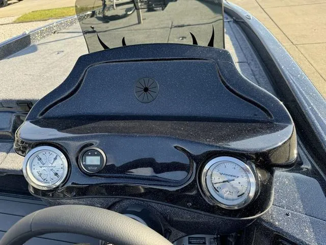Slide: The Image of Dashboard of 2025 Phoenix 921 ELITE boat with gauges and steering wheel. - 6