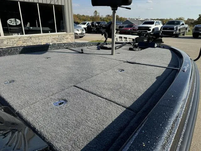 Slide: The Image of 2025 Phoenix 921 ELITE boat deck with carpeted surface and storage compartments. - 8