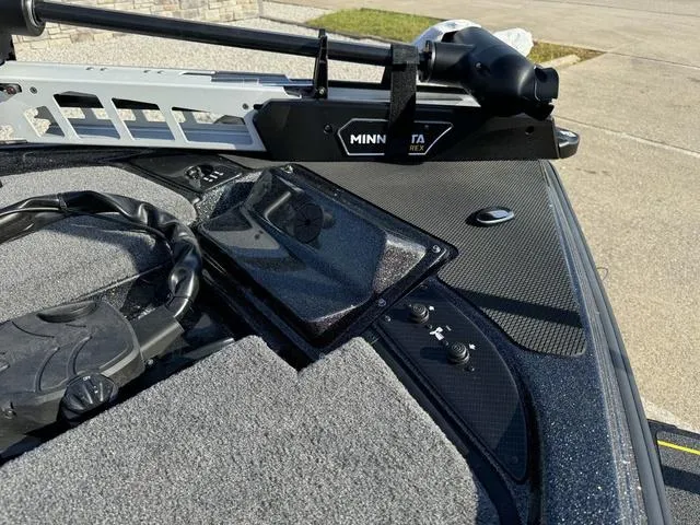 Slide: The Image of Close-up of 2025 Phoenix 921 ELITE boat deck with Minn Kota trolling motor. - 9