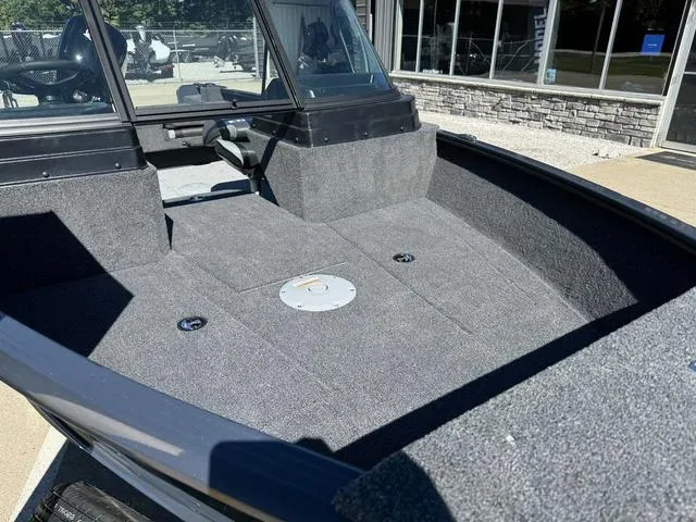 Slide: The Image of 2025 Lund 1775 Adventure Sport boat interior with spacious deck and windshield. - 10